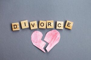 broken heart on gray background and inscription divorce made by wooden blocks broken family concept photo Rebuilding Confidence After Divorce: Finding Yourself Again